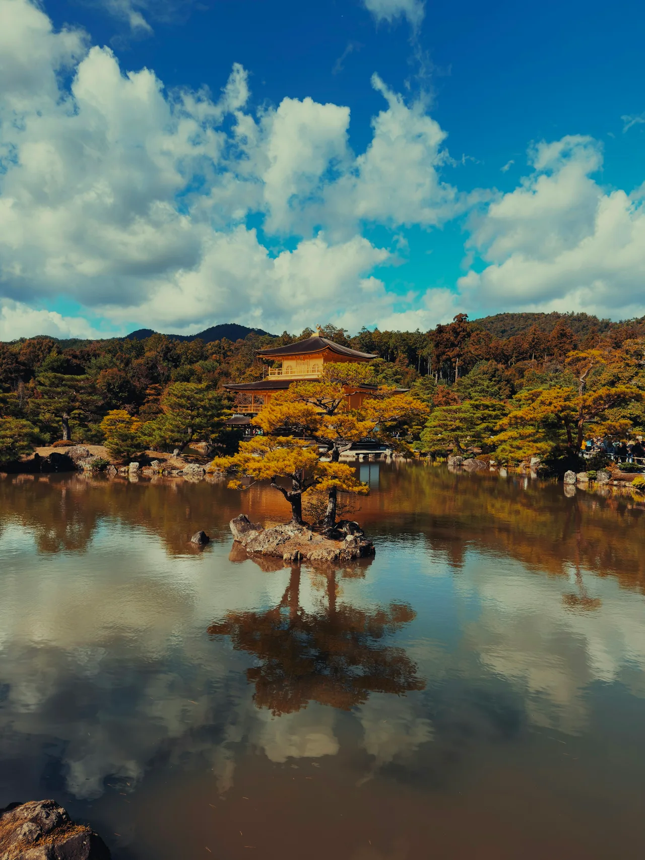 Kyoto's golden Kinkaku-ji reflected in a quiet garden pond